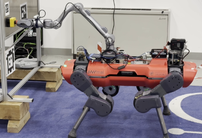 ANYmal quadruped robot with a manipulator arm in the Oxford Robotics Institute lab